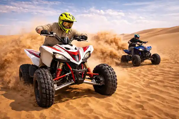 Desert quad bike riding adventure on sand dunes, high-speed off-road ATV action